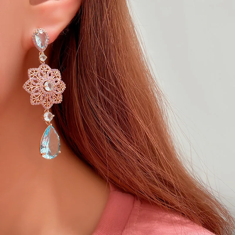

Golden purple diamond hollow flower earrings light blue drop pendant national wind earrings niche earrings