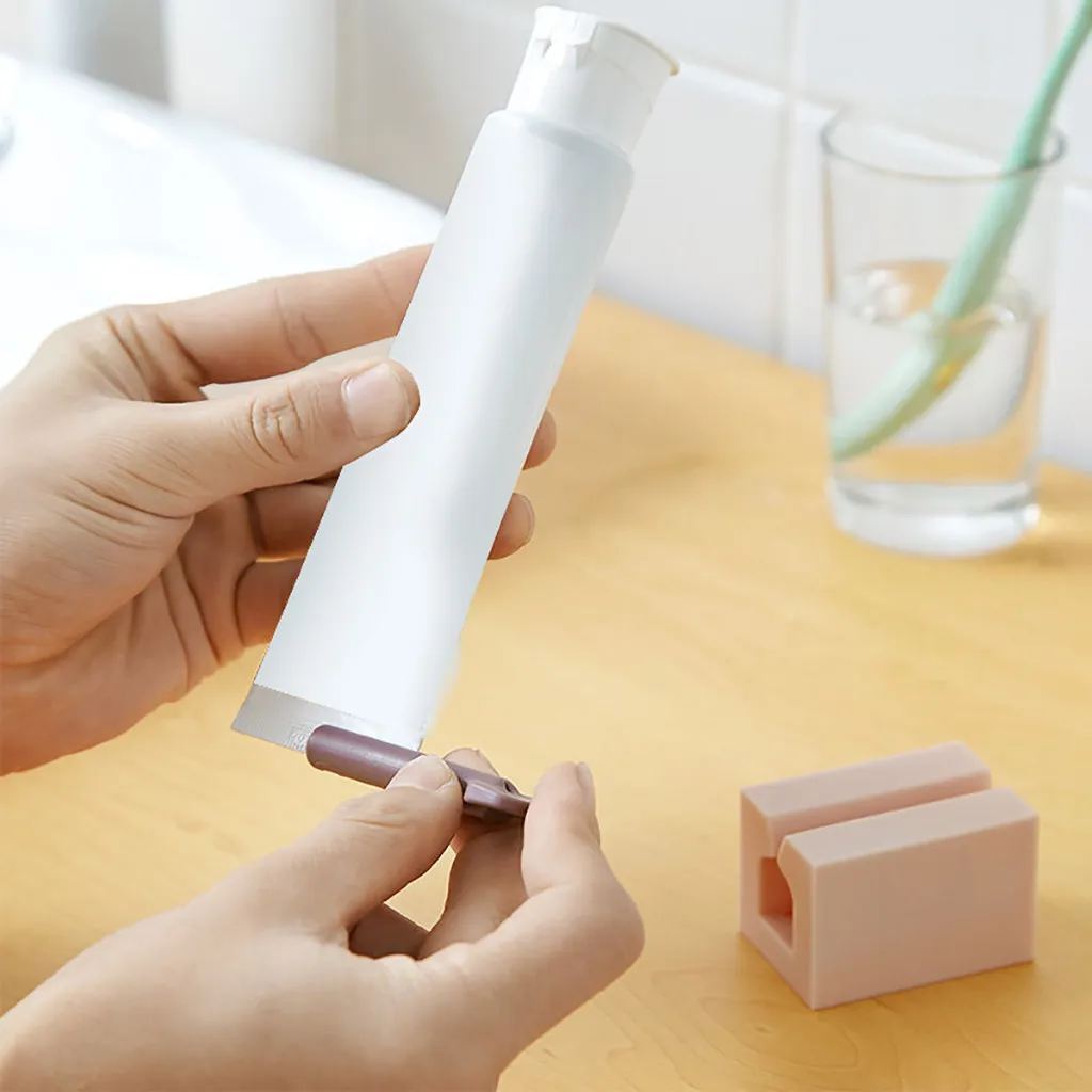 

Multifunctional Bathroom Plastic Cream Tube Squeezing Dispenser Rolling Tube Squeezer Tooth Paste Squeezer Toothpaste Dispenser