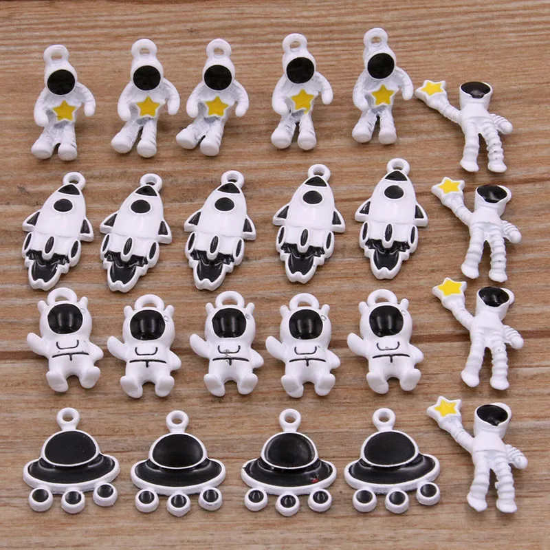 

10Pcs 5 Style 5 Size Metal Alloy White Alien Rocket Spaceship Charms Astronaut Pendants For Jewelry Making DIY Handmade Craft