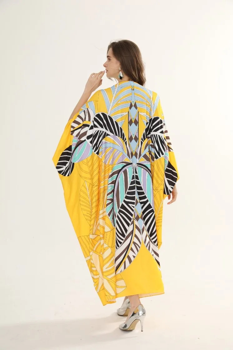 

Women's dress in autumn and winter 2020 new irregular large swing sleeve V-neck one row button knitted silk loose dress printed