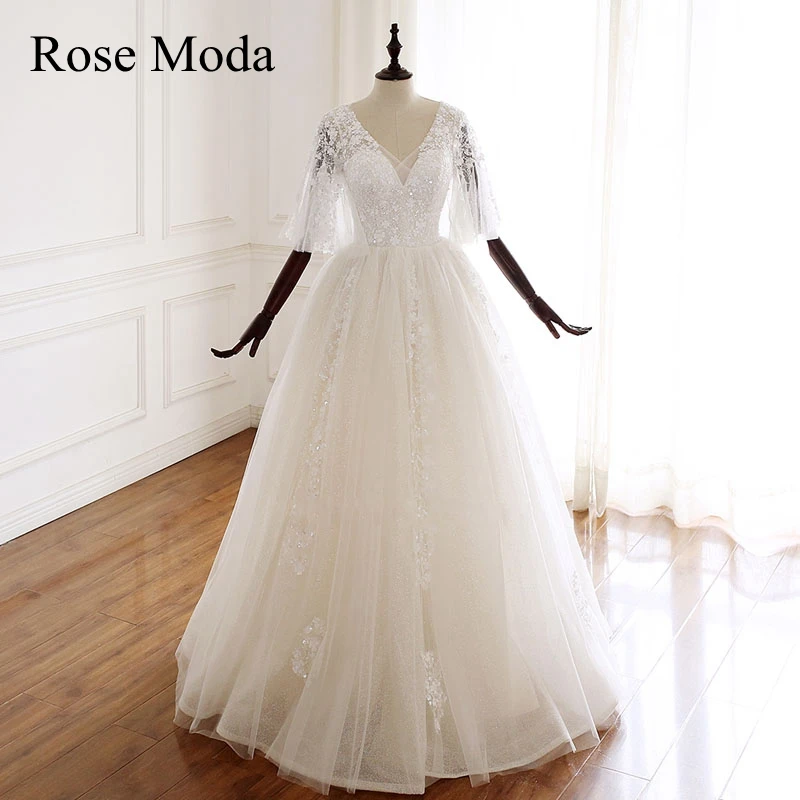 

Rose Moda Half Sleeves V Neck Glittering Wedding Dress with 3D Beadings Lace Up Back