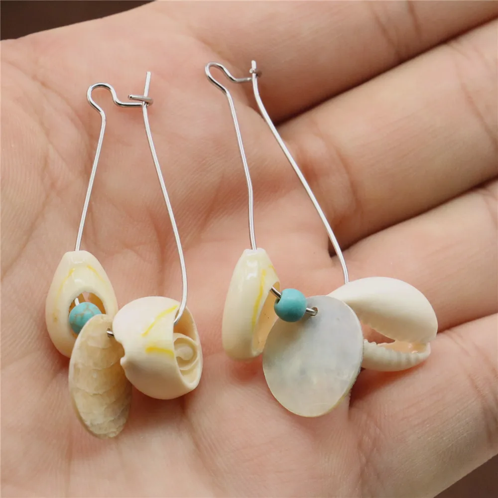 

Женские длинные серьги-кисточки в виде ракушек