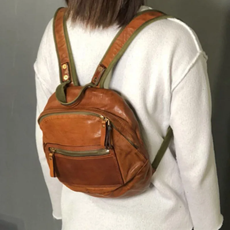 

Original new first layer cowhide shoulder bag men and women flow vegetable tanned leather shell-shaped soft leather backpack