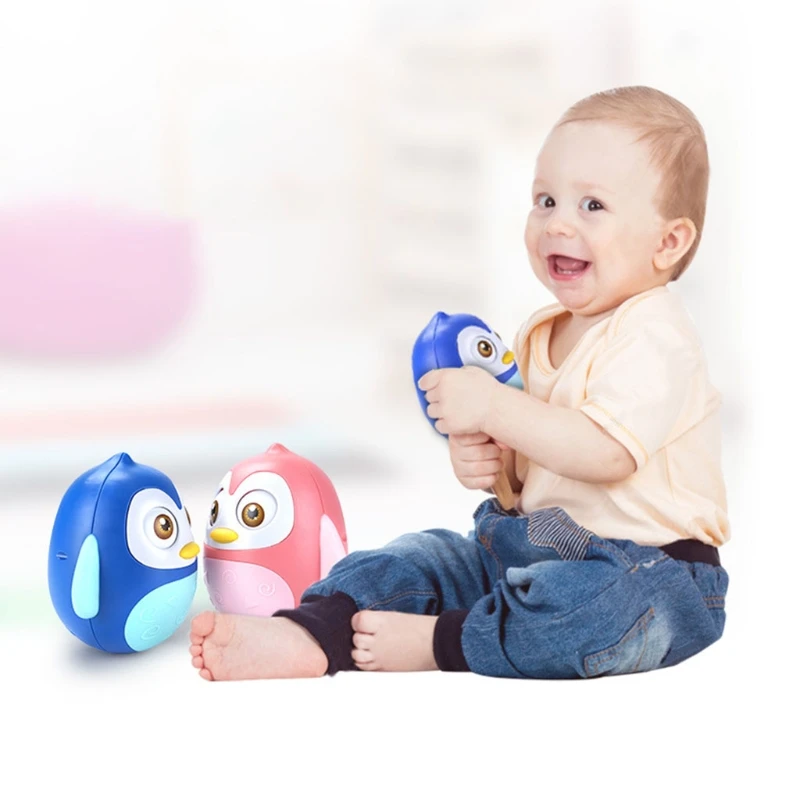 

Plastic Winking Tumbler Toy Blue /Pink Music Wobbler Baby Toy Gravity Sensor Exercise Baby's Perception Ability 1 Piece