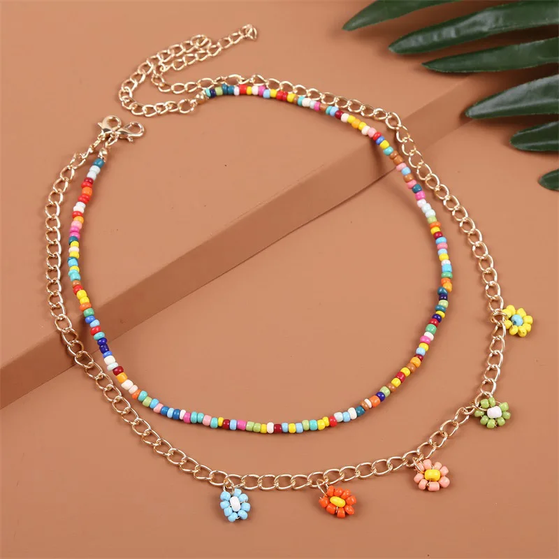 

Charmsmic Multilayer Glass Bead Chain Necklaces Small Flower Metal Charm Necklaces Handmade Jewelry Wholesale Factory Price