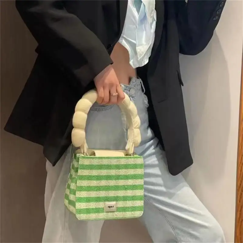 

Tagi twist bag manual handle Advanced fat handle velvet silk quilted stripe lattice handbag armpit bag winter