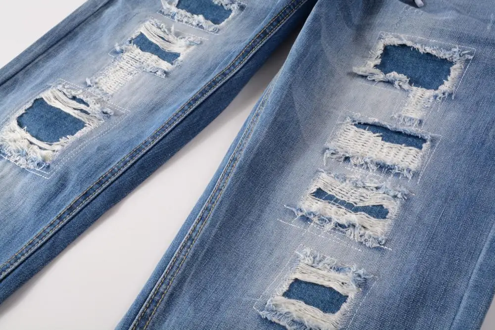 

New men's male trousers street fashion style lanyard cut hole exposed cotton yarn bottom denim border straight jeans for men