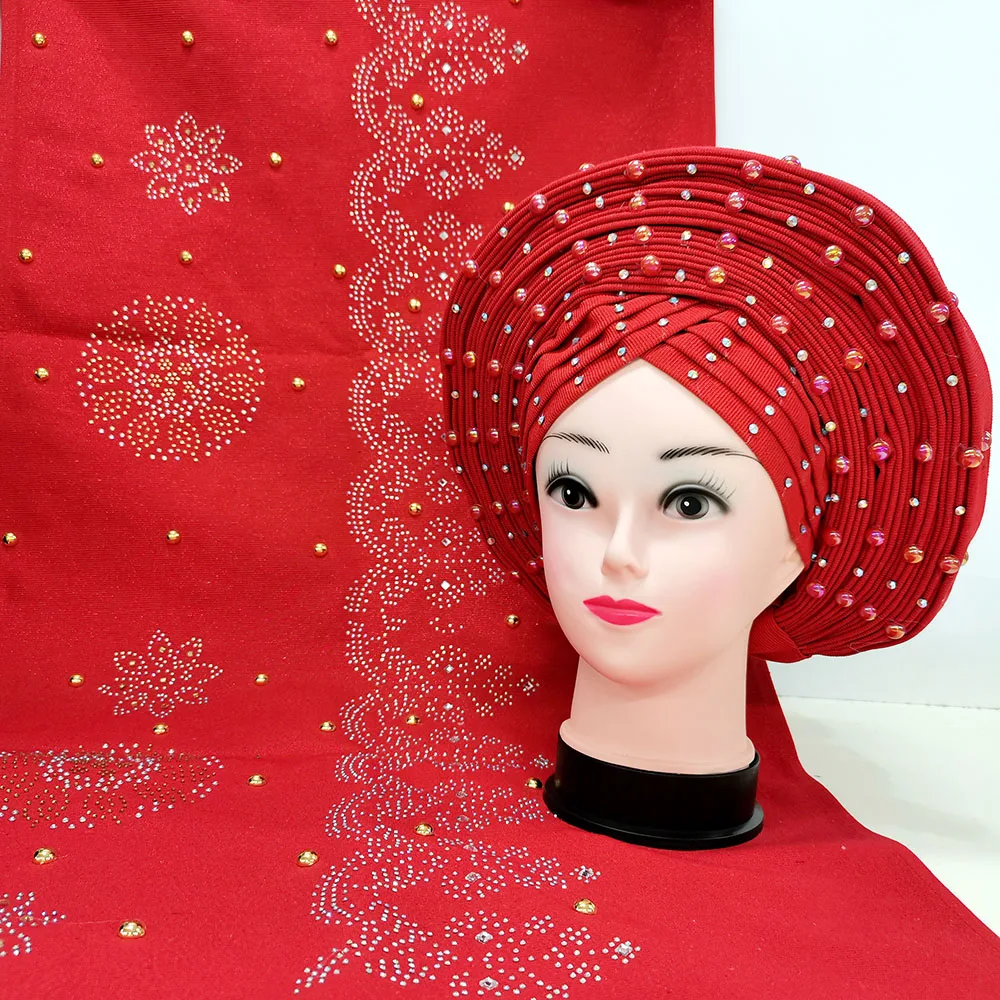 

Свадебные красные африканские женщины Aso Oke со множеством камней Нигерия Aso Oke головной убор для женщин вечерние ринка свадьба