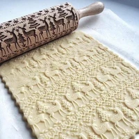 baked cookies biscuits biscuits dough carved reindeer snowflakes christmas embossed rolling pin