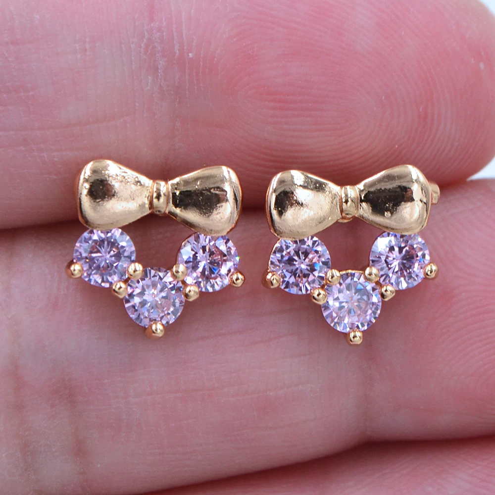 Женские серьги гвоздики с бантом золотого цвета кубическим цирконием класса ААА