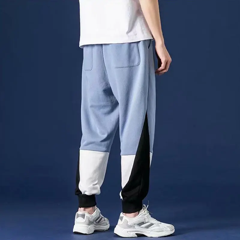 

Spring and autumn new color matching pants men's Korean fashion casual pants stretch loose Joker toe sports pants
