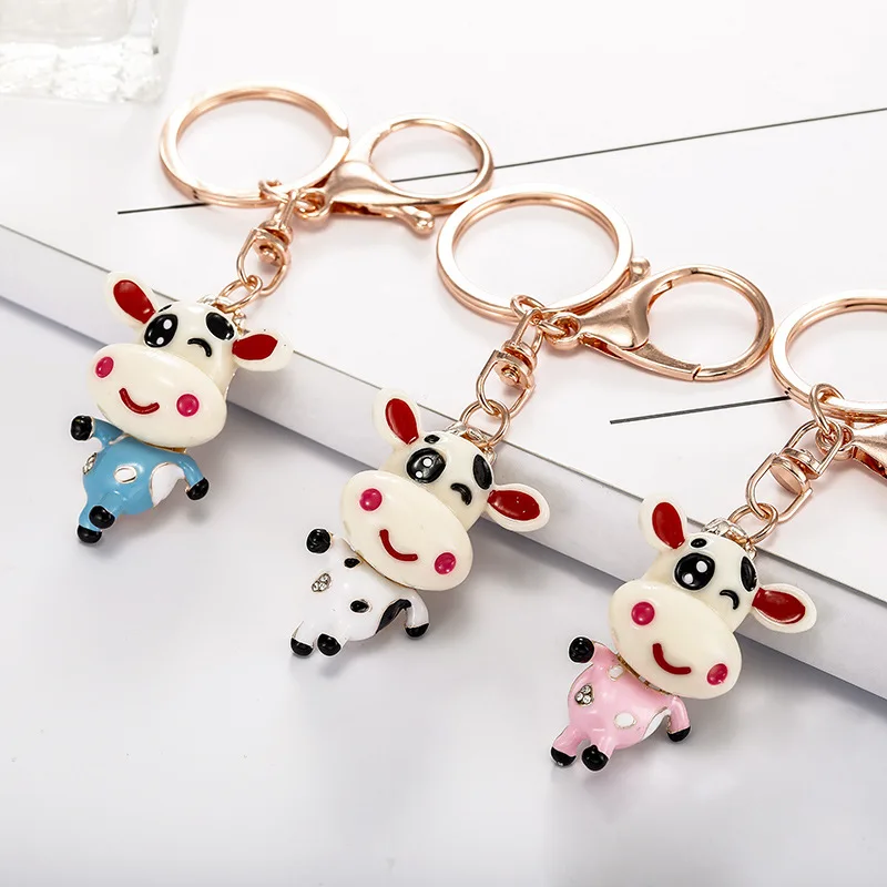 

Роман изысканный корова цепочка для ключей из металлического сплава автомобиля с брелком-держателем для ключей, женская сумка с подвеской, ...