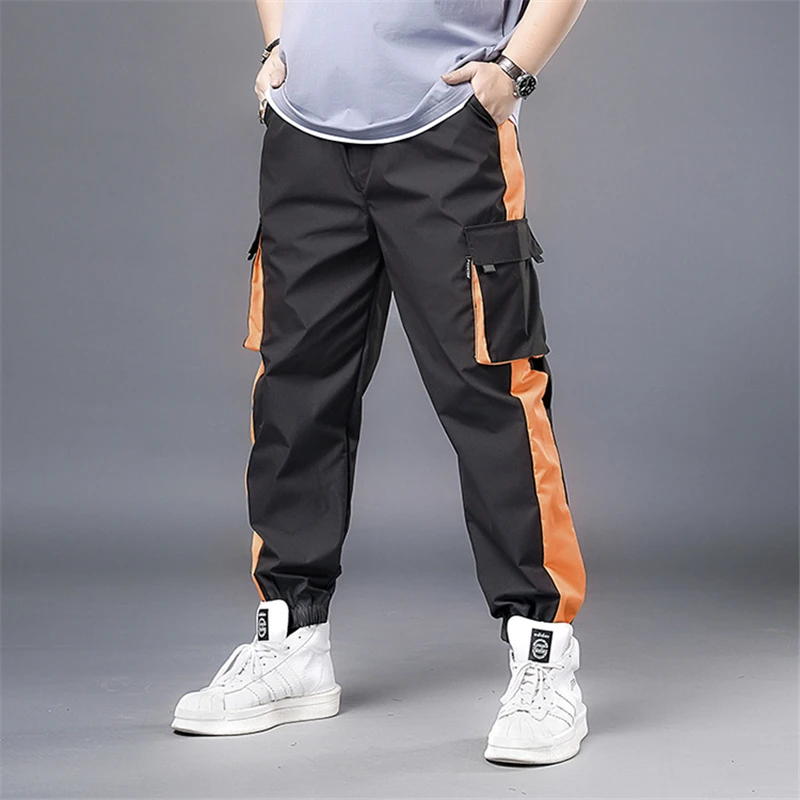 Оранжевые штаны с боковыми полосками пэчворк уличная одежда брюки-карго мужские