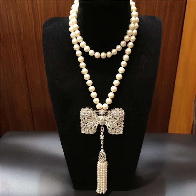 Hot sell new style 8-9mm white freshwater pearl necklace bowknot zircon accessories long tassel sweater chain fashion jewelry