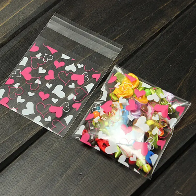 

100PCS Cute Heart Transparent Cookies Candies Bag Self-adhesive Christmas Food Baking Gift Packaging Bags Stationery Holder