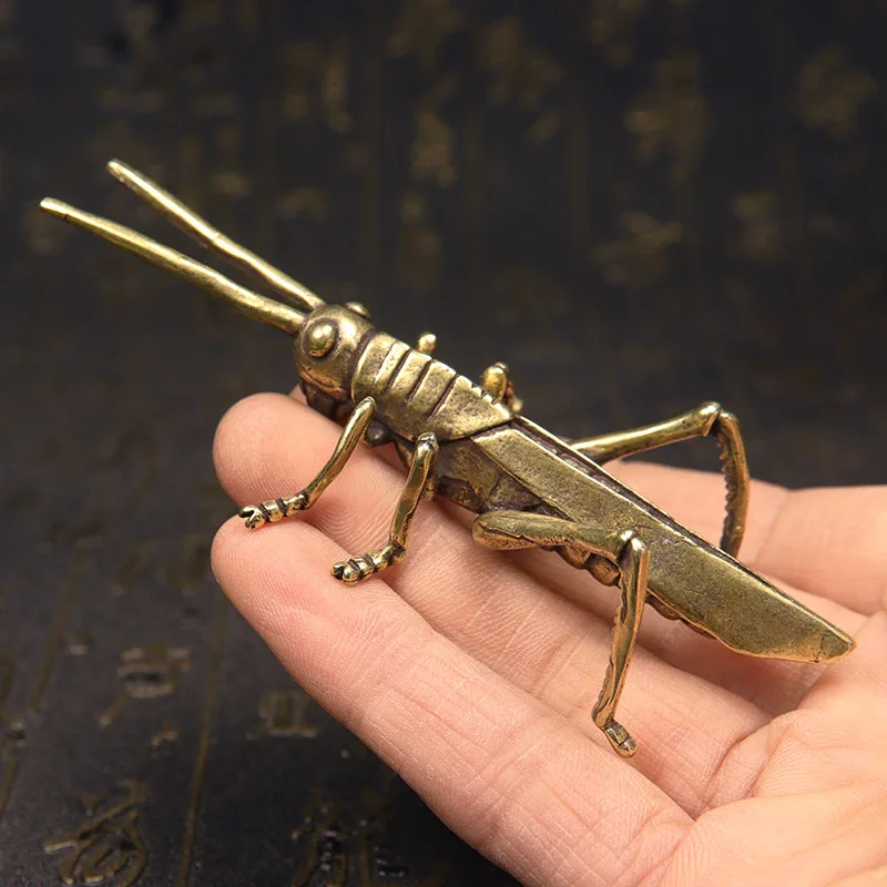 

Медные фигурки кузнечиков