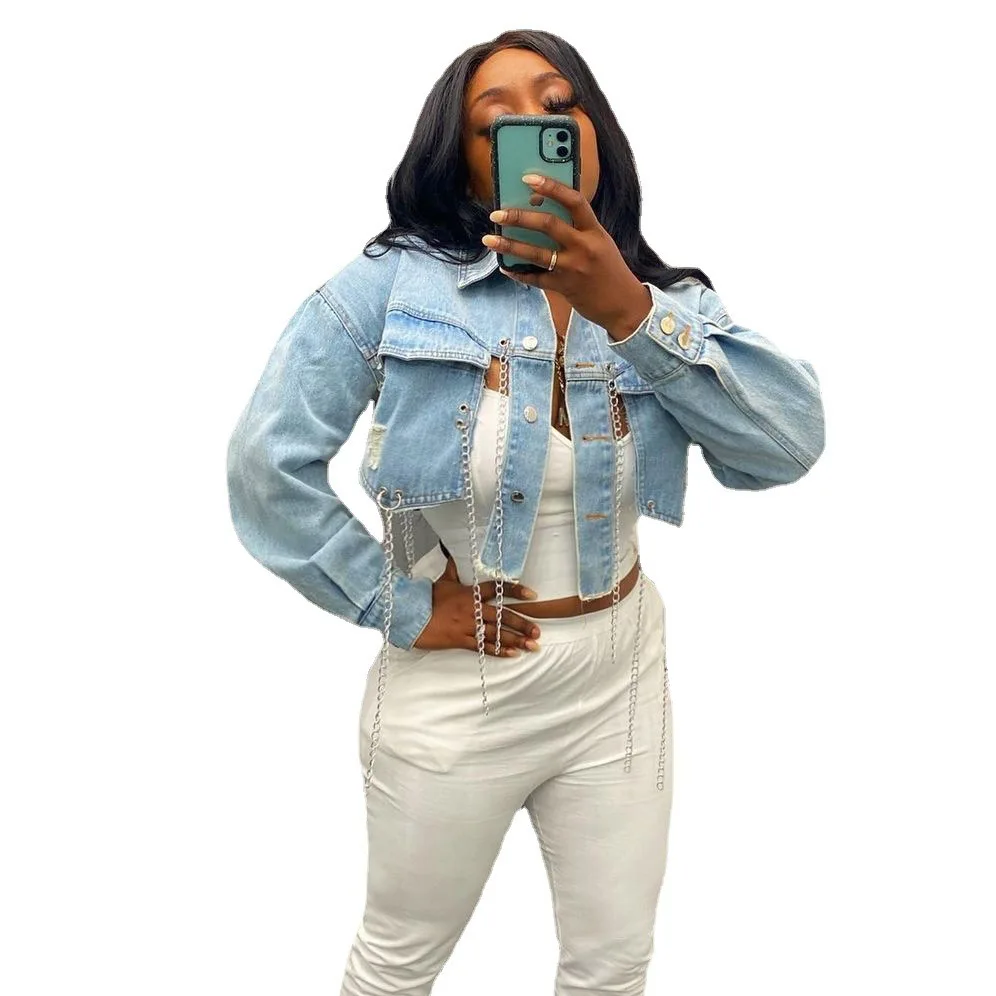 

Summer 2021 Trend Streetwear Light Blue Ripped Denim Jacket Women Asymmetric Short Jacket Tops Long Sleeve Backless Chain Coat