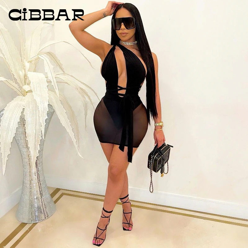 

CIBBAR Hollow Out Skinny Women Two Piece Sets One Shoulder Bodysuit And Mesh Mini Skirt Suits Sexy See Through Club Outfit 2021