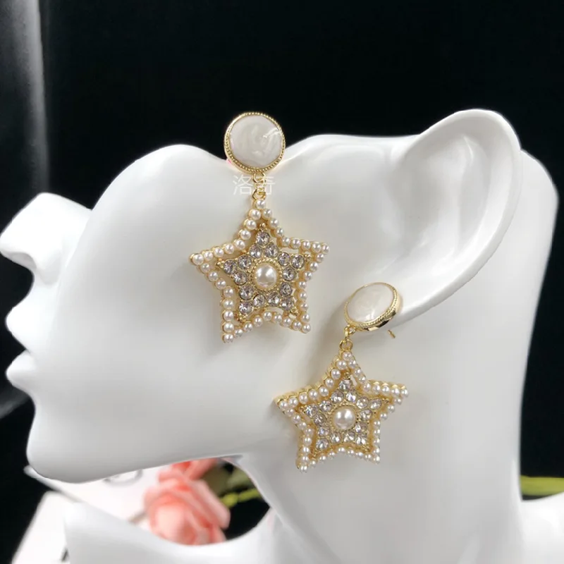 

Пятиконечные элегантные серьги из серебра с искусственным жемчугом