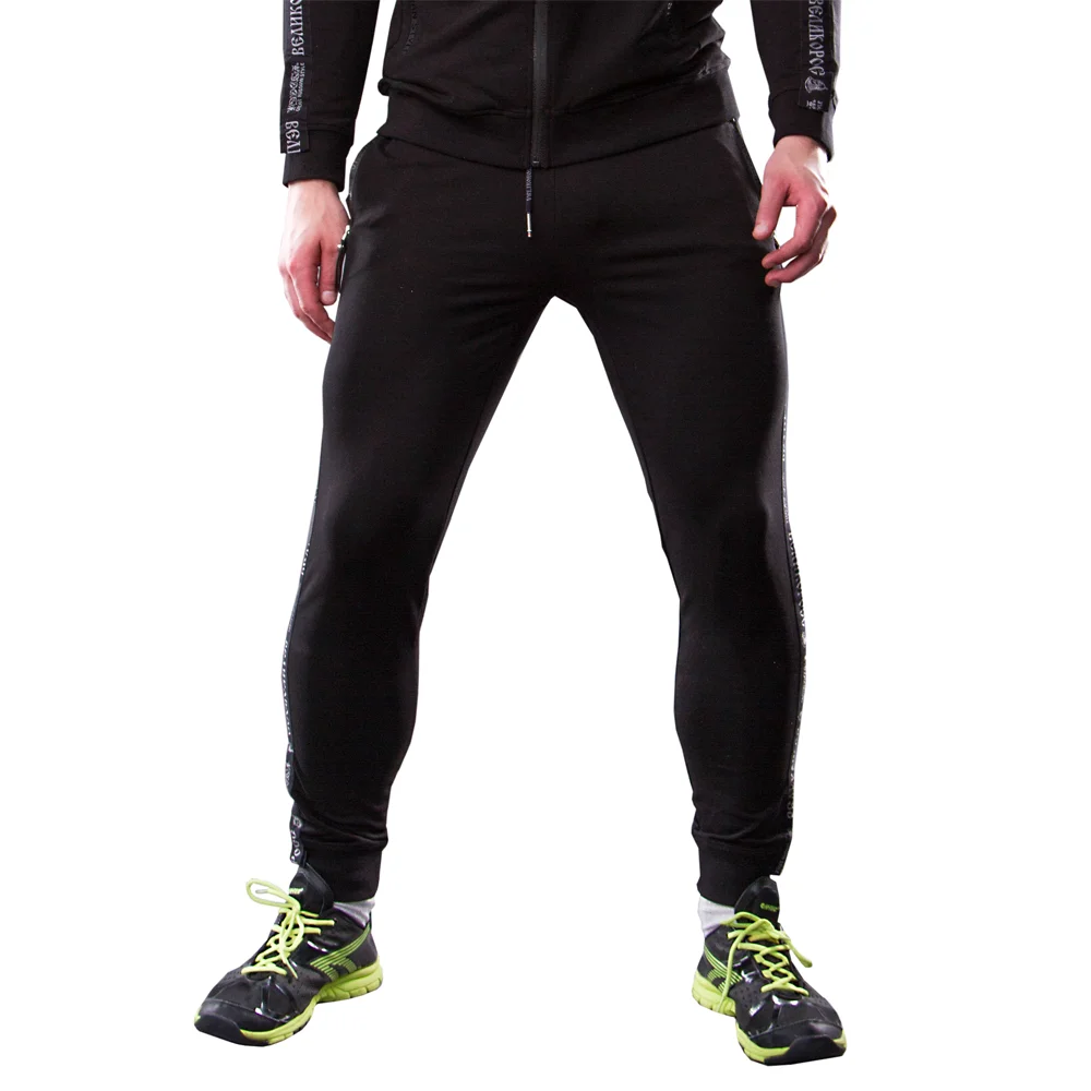 Спортивные штаны Великоросс черного цвета жаккардовые лампасы и брендовые