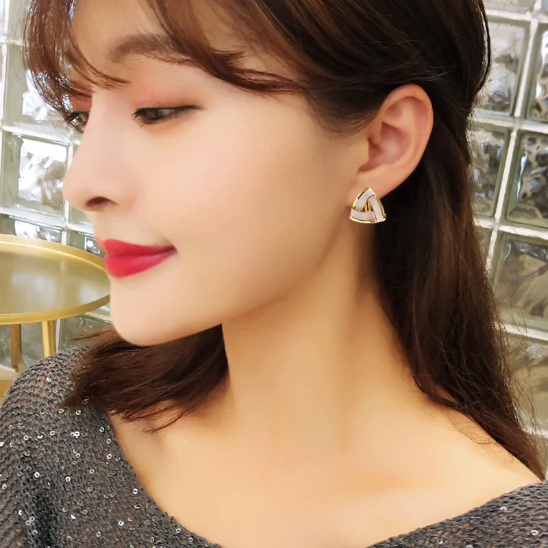 

Fashion jewelry net red temperament simple triangle dripping oil commuting unusual earrings female ears nail gifts wholesale