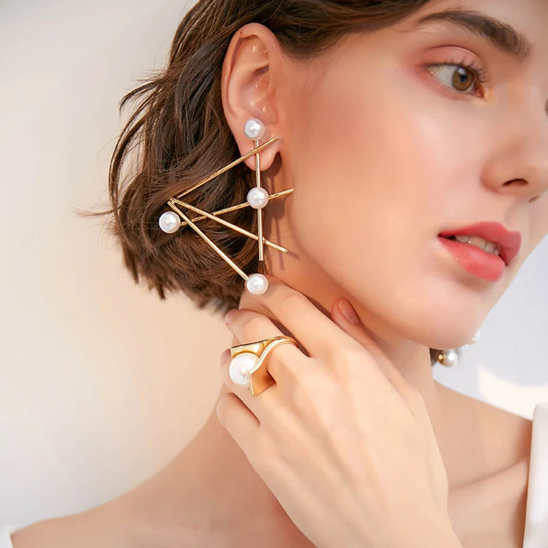 

Korean temperament wild 925 silver needle earrings female personality simple fashion triangle earrings artificial pearl earrings