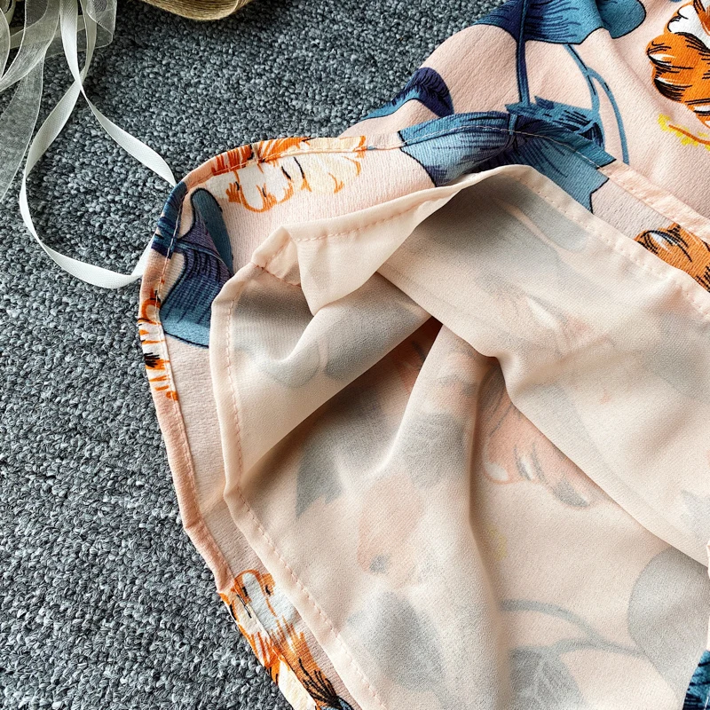

Aibeautyer New Summer Casual Loose Floral Print Jumpsuits Holiday Beach Jumpsuits Women Sexy Spaghetti Strap Backless Jumpsuits