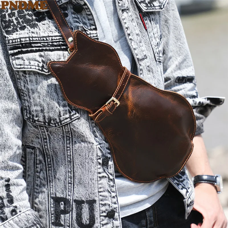 

PNDME retro crazy horse cowhide men women cute cat shape chest bag fashion natural real leather designer shoulder crossbody bag
