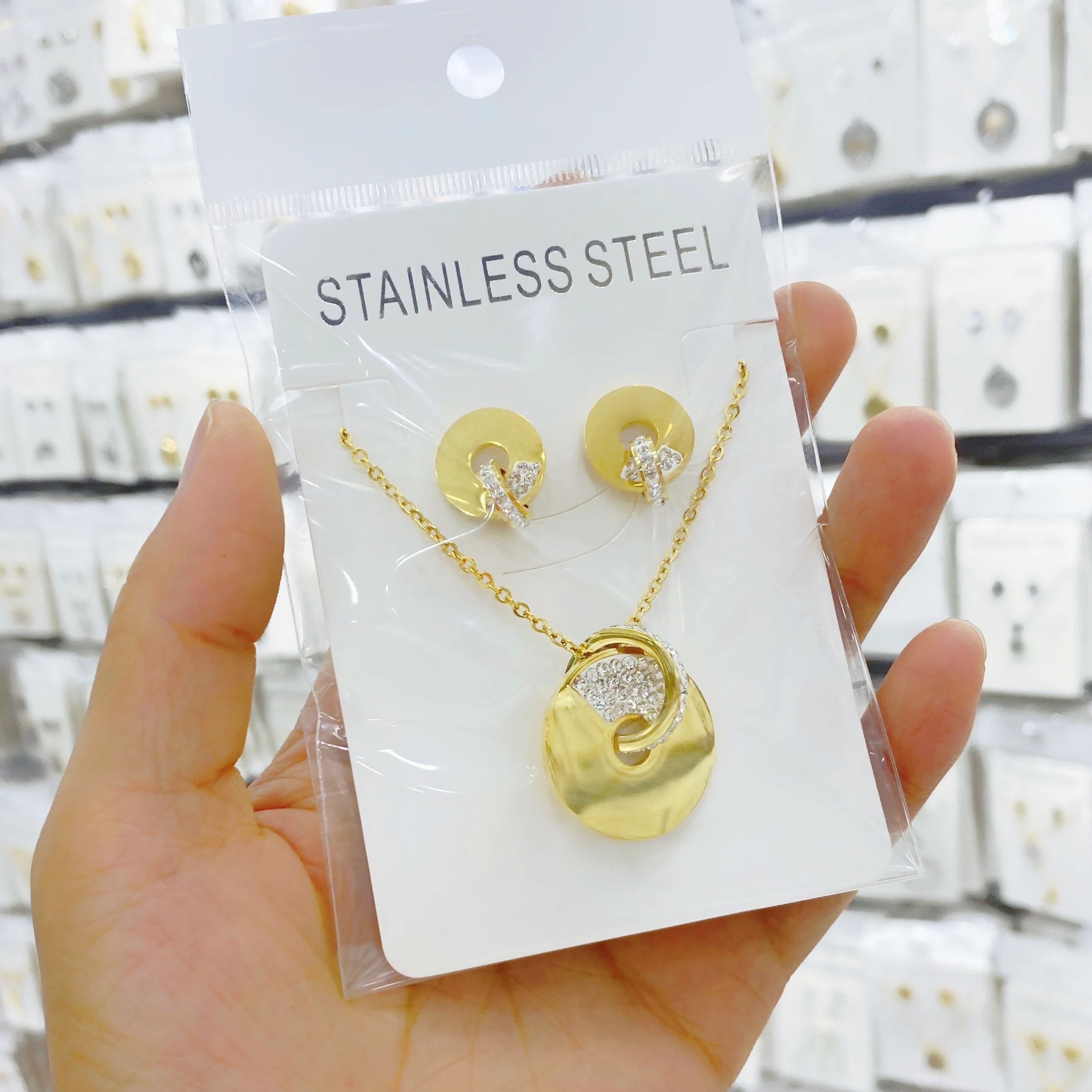 

Stainless steel pendant necklace and earrings with large glossy polished fashionable women's favorite