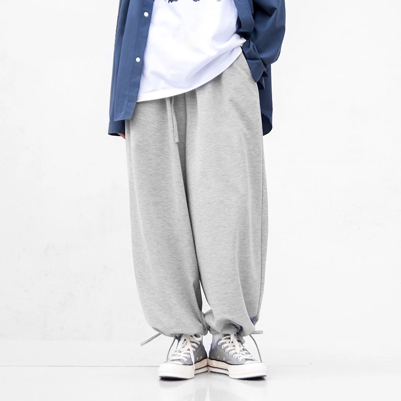 Брюки-шаровары унисекс на шнуровке серые и черные спортивные штаны в стиле