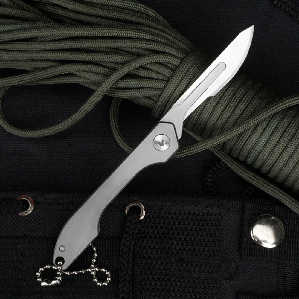 

Titanium Alloy Surgical Utility Folding Knife With 10pcs Blade Fast Open Removable Blade Outdoor Survival Pocket Knives EDC Tool