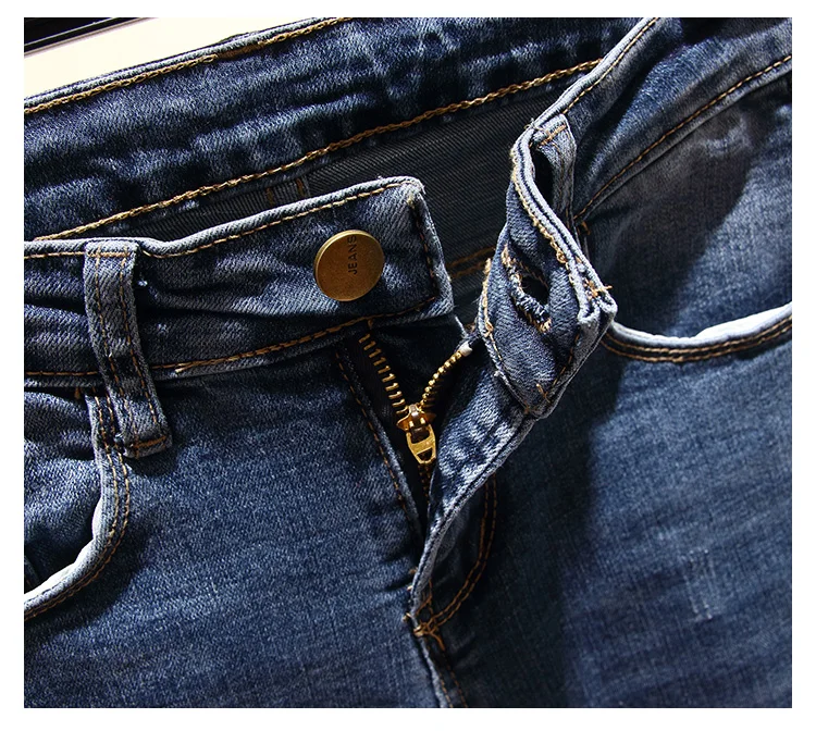 Джинсы с высокой талией обтягивающие большие размеры на молнии отворотом по