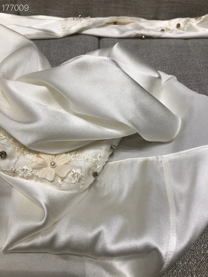 

Spring and summer 2021 elegant style V collar lotus leaf edge pleated hot diamond waist sleeveless broken flower skirt dress