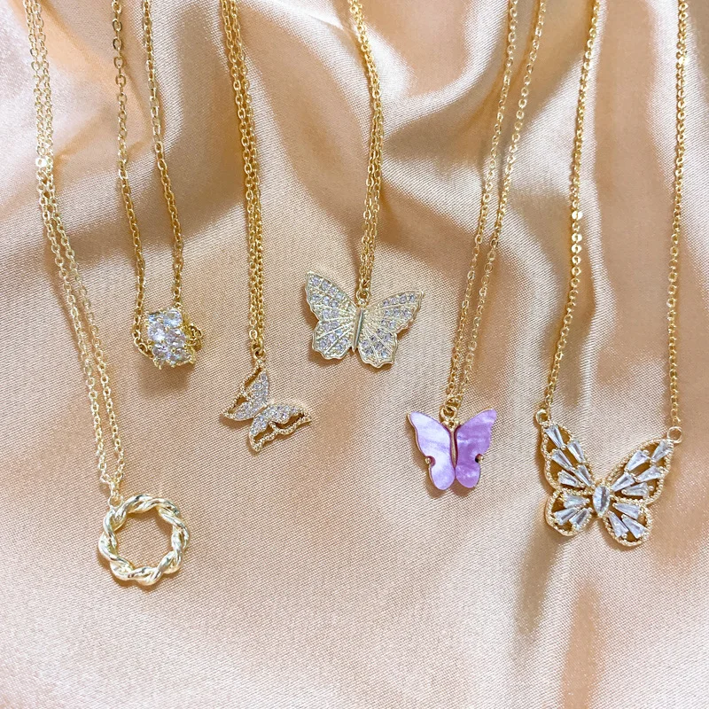 

TIMEONLYTemperament Hollow Out Flower Pendant Necklace for Women Bling Bling Butterfly Trumpet Pearl Love Heart Necklace Jewelry