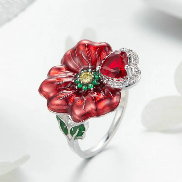 Качественное кольцо с розовым цирконием и красной огранкой принцессы