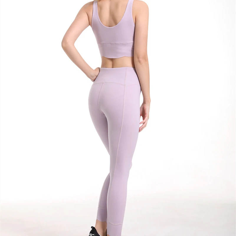 

Hot Selling High Quality Women's Yoga Suit Solid Color Sleeveless Bra Vest High Waist Tights Breathable Fitness Two Piece Set