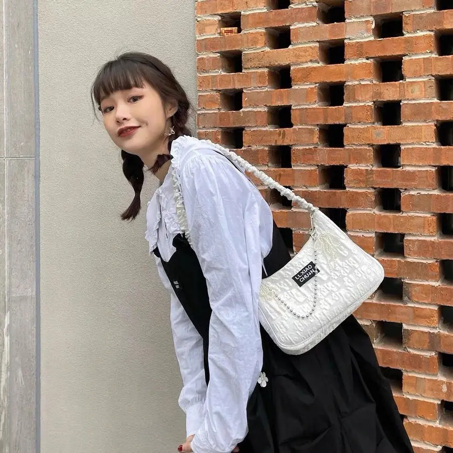 

2021 new black and white flower bubble Jacquard underarm bag drawstring shoulder strap Pearl bow sweet spice girl bag [