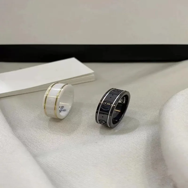 

Trendy fashion double G black and white ceramic inlaid gemstone gold silk couple ring high quality customized exquisite gift