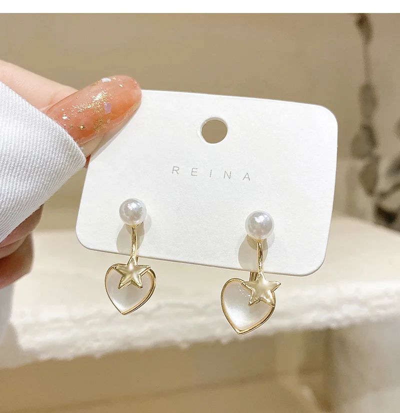 Korean fashion personality cat eye stone pearl love eardrop female temperament exquisite s925 silver needle earrings personality temperament korean edition earring fashion ol white zirconia blue topping stone tremella nail allergy