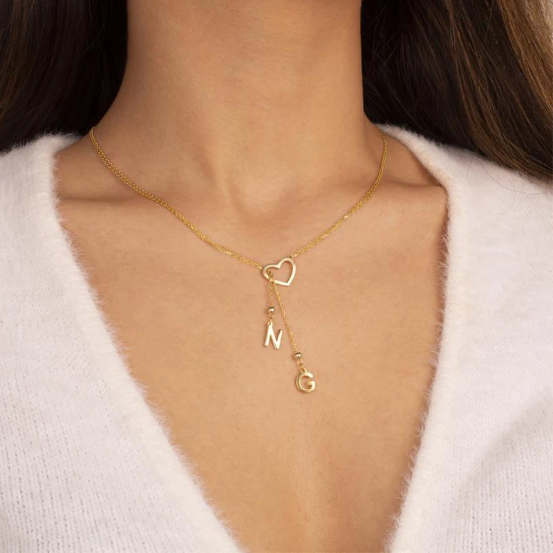 

Новая мода темперамент трендовые ювелирные изделия из нержавеющей стали, полые, в форме сердца A-Z колье с подвеской в виде буквы дамы Банкетный подарок