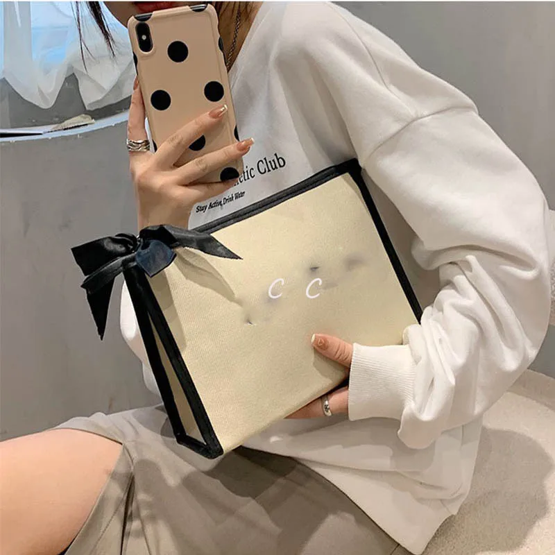 

Korea cosmetic bag small fragrance large capacity portable travel fashion portable storage bag canvas bag trend letter C letter