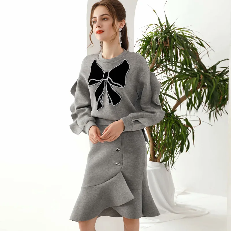 

2020 SPRING ROUND BOW-TIE RUFFLE TOP & ASYMMETRICAL SKIRT SET