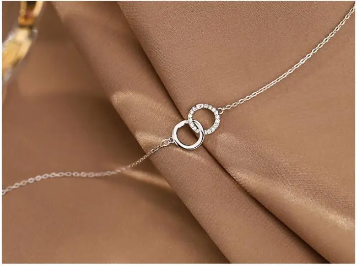 Ожерелье женское с двойным кольцом и прозрачными кристаллами - купить по