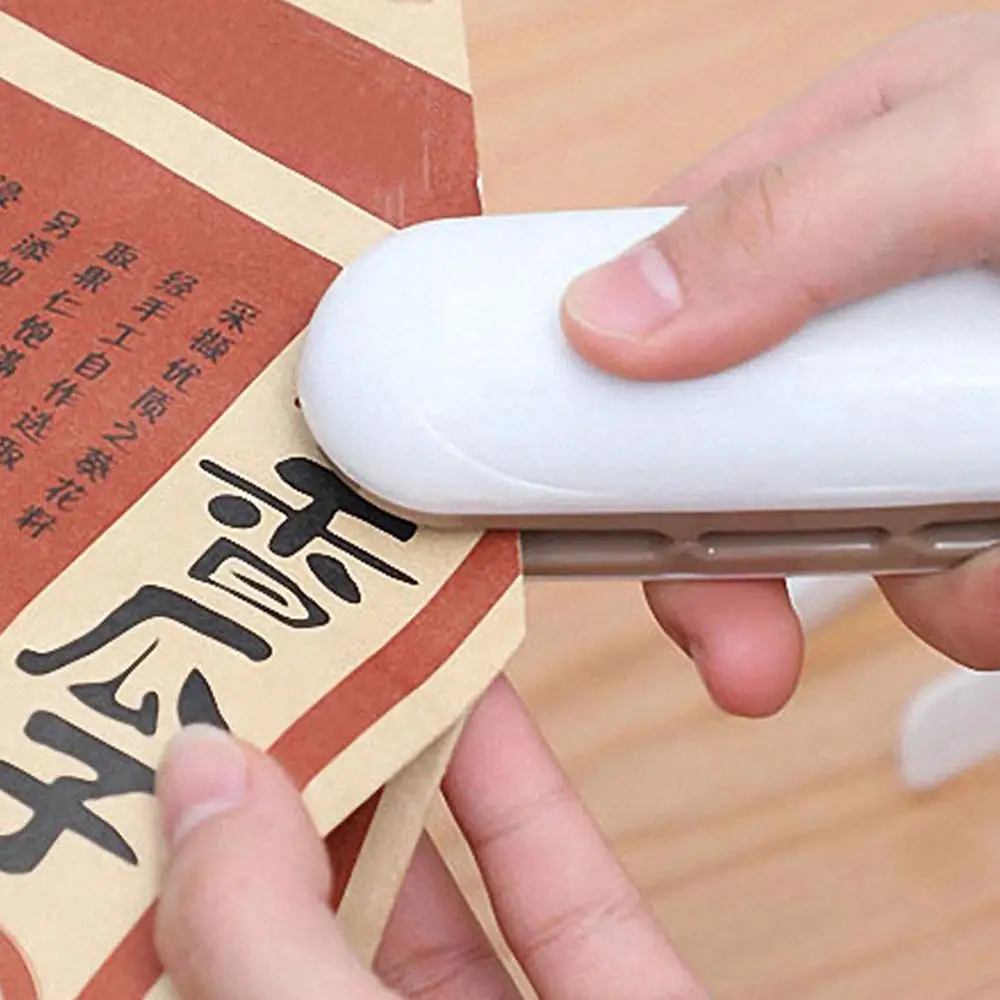

Hand Pressure Sealing Machine Mini-Portable Double-Sided Heating Snack Bag Sealing Machin Household Small Tools White