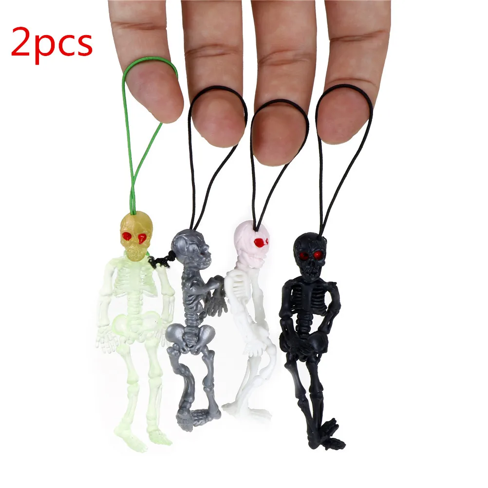 

2pcs/lot Rubber scaryskull toys mini Luminous Glow In The Dark Skeleton Hanging Decoration