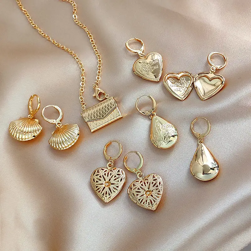 

Женские серьги-подвески в виде ракушек и сердец