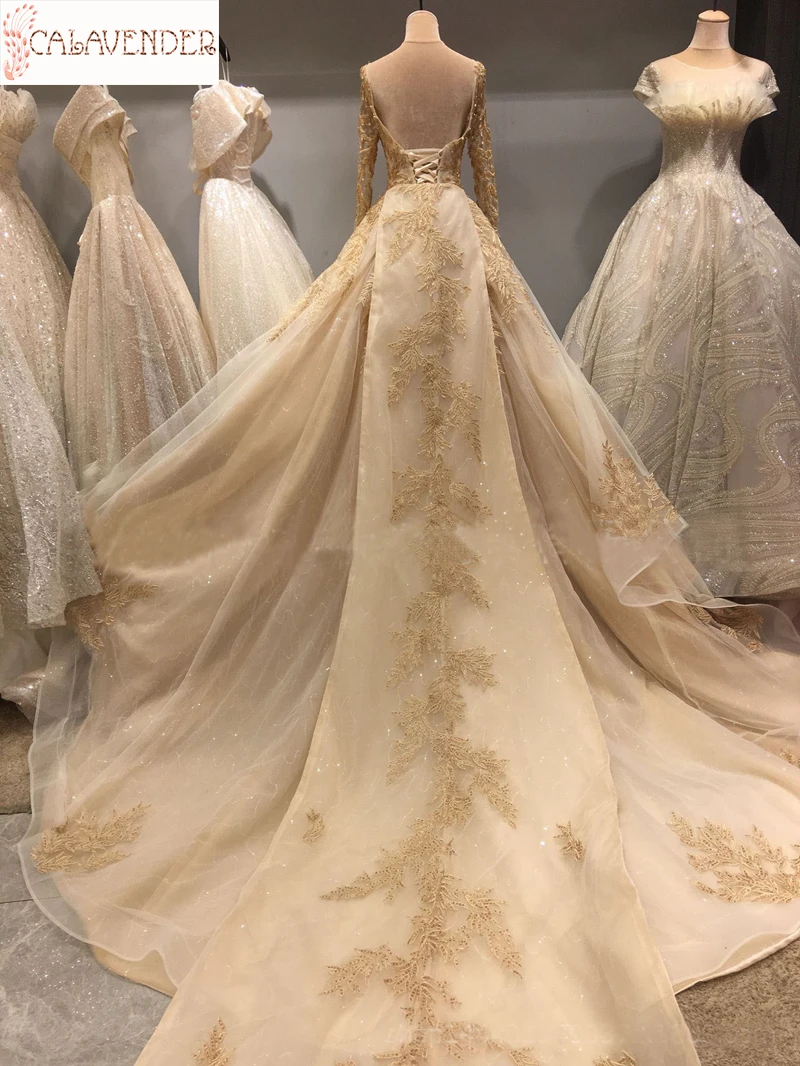

Lace Gold Wedding Dresses Ball Gown Appliques Crystals Beaded Wedding Gown with Chapel Train Long Sleeve Bridal Dresses vestidos