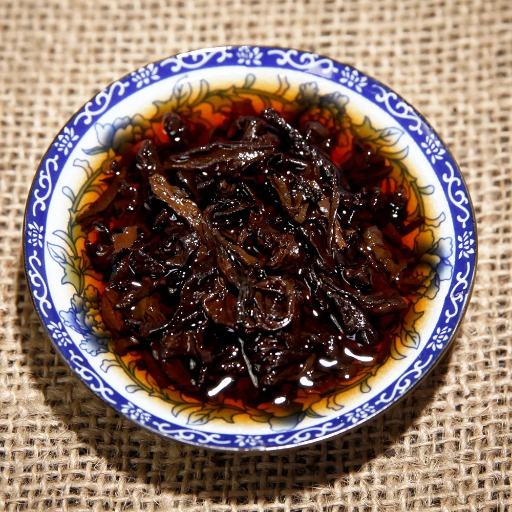 

China Yunnan Yunnan Qizi Cake Qianxi Valley 357g Mountain Tree Ripe Pu'er Tea pu'er Cooked Tea Cake Jishun Hao