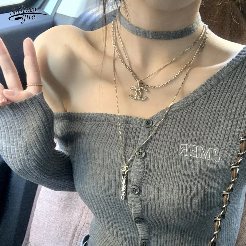 

Early autumn long-sleeved sweater hot girl design sense cardigan slim bottoming slanted shoulder hanging neck sweater top 16659