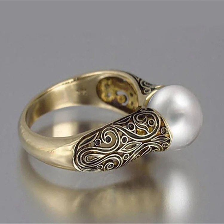 

Suitable for ladies 5-12 inlaid with fine synthetic large pearl lady ring hollow retro lovely wedding ring
